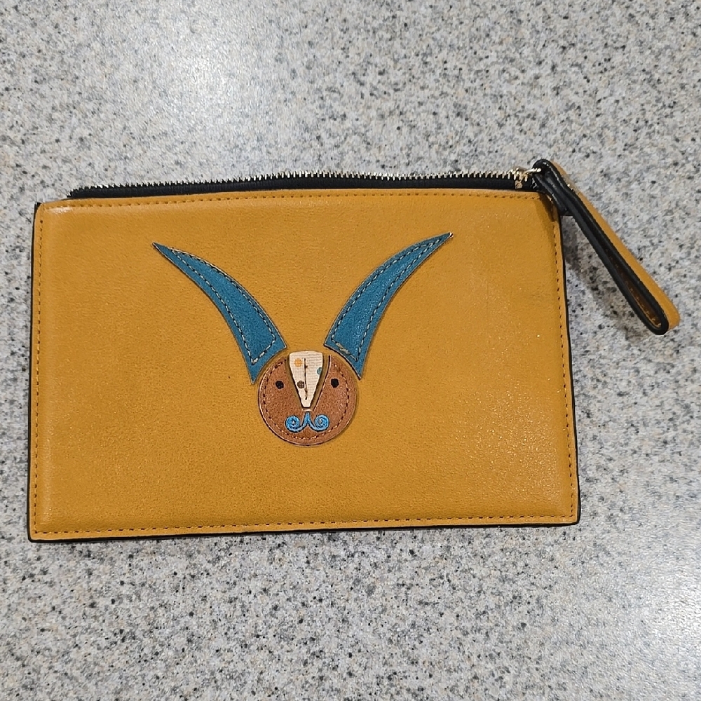 Capricornio Mustard Wristlet with Blue Design